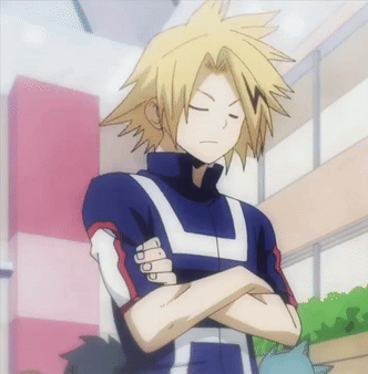 A Boy With Yellow Hair Is Standing With His Arms Crossed And His Eyes Closed . GIF
