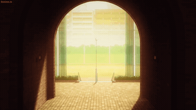 A Brick Archway Leading To A Baseball Field With A Sign That Says Anime.tv GIF
