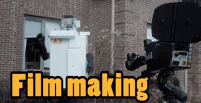 A Brick Building With The Words Film Making On It GIF