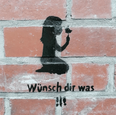 A Brick Wall Has A Stencil Of A Girl Holding A Flower And The Words Wunsch Dir Was GIF