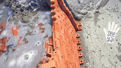 A Brick Wall Is Being Built With A Hand That Says See Ya GIF