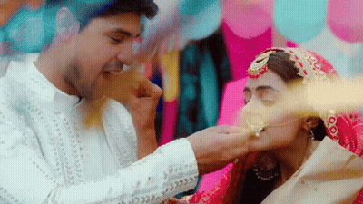 A Bride And Groom Are Kissing And The Bride Is Wearing A Nose Ring GIF