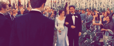 A Bride And Groom Are Walking Down The Aisle At Their Wedding Ceremony GIF