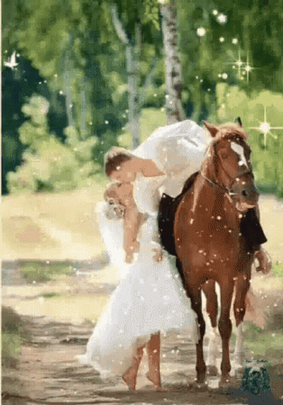 A Bride And Groom Riding On The Back Of A Horse GIF