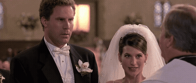A Bride And Groom Stand In Front Of A Priest At Their Wedding GIF
