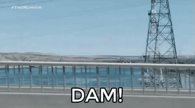 A Bridge Over A Body Of Water With The Words Dam On It GIF