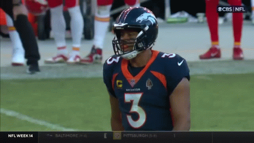 A Broncos Player Wearing Number 3 Stands On The Field GIF