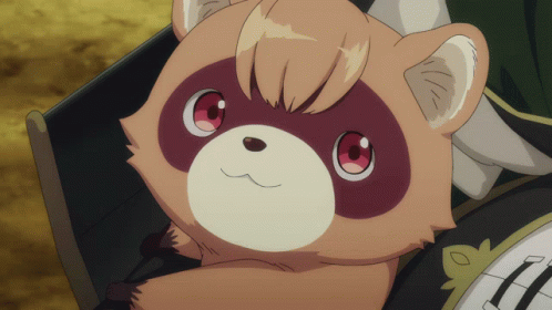 A Brown And White Animal With Red Eyes Is Sitting On A Table GIF