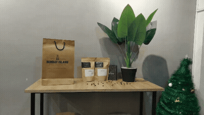 A Brown Bag From Bombay Island Sits On A Table GIF
