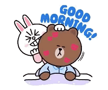 A Brown Bear And A White Rabbit Are Sitting On A Bed And The Rabbit Is Kissing The Bear On The Forehead . GIF