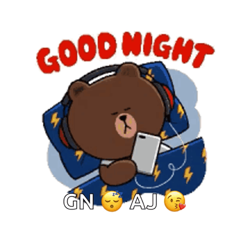 A Brown Bear Wearing Headphones Is Laying In Bed Looking At A Cell Phone .. GIF