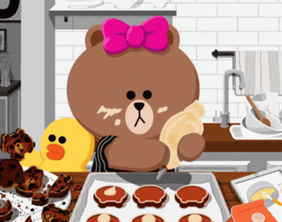 A Brown Bear With A Pink Bow On Her Head Is Baking Cookies In A Kitchen GIF