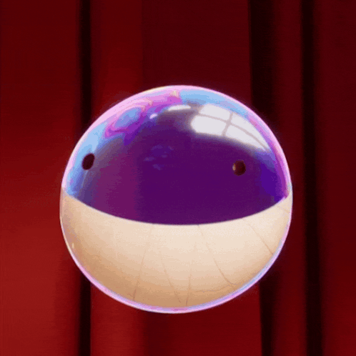 A Bubble That Looks Like A Shark 'S Mouth Is Floating On A Red Curtain GIF