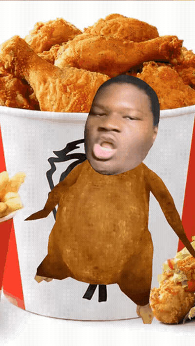 A Bucket Of Fried Chicken With A Man 'S Face In It GIF