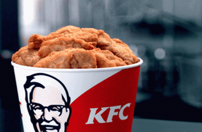 A Bucket Of Kfc Fried Chicken With A Picture Of Mr. Kentucky On It GIF
