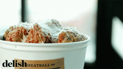 A Bucket Of Meatballs With A Label That Says Delish Meatball Shop GIF