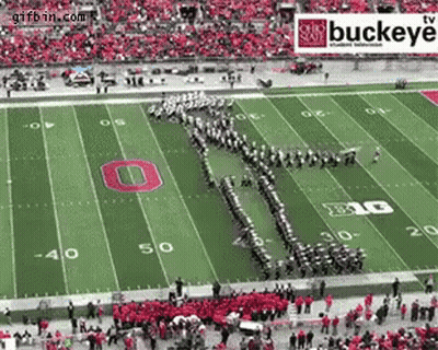 A Buckeye Football Field With A Marching Band On The Field GIF