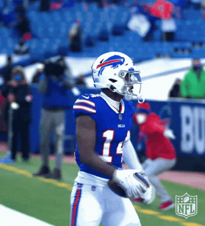 A Buffalo Bills Football Player Is Holding A Football GIF