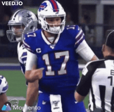 A Buffalo Bills Football Player Is Pointing At A Referee During A Football Game . GIF