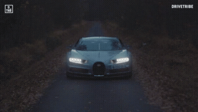 A Bugatti Chiron Is Driving Down A Road With The Words Drivetribe On The Bottom GIF