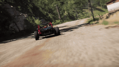 A Buggy Is Driving Down A Dirt Road With Trees In The Background GIF