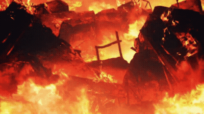 A Building Is On Fire With A Cross In The Middle Of It GIF