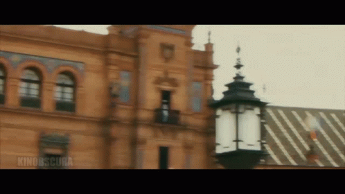 Building With Rino Obscura Sign And Lamp Post GIF