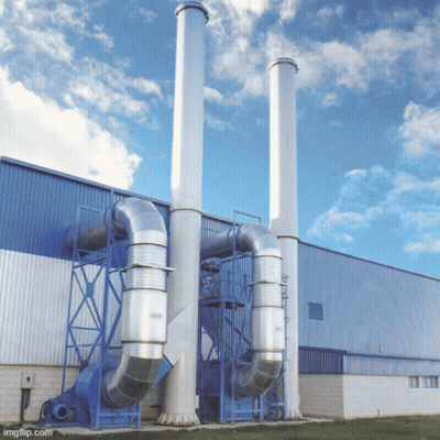 A Building With A Lot Of Pipes And Chimneys On The Side Of It GIF