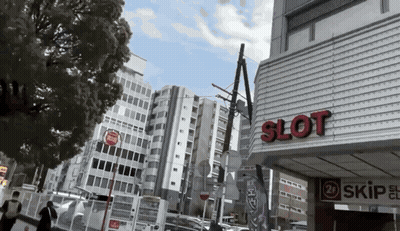 A Building With The Word Slot On The Side Of It GIF