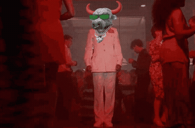 A Bull Wearing Sunglasses And A Necklace Is Dancing In A Crowd GIF