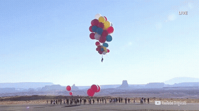 A Bunch Of Balloons Are Flying In The Air With A Youtube Logo In The Background GIF