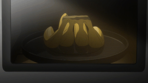 A Bunch Of Bananas Sitting On A Black Plate GIF