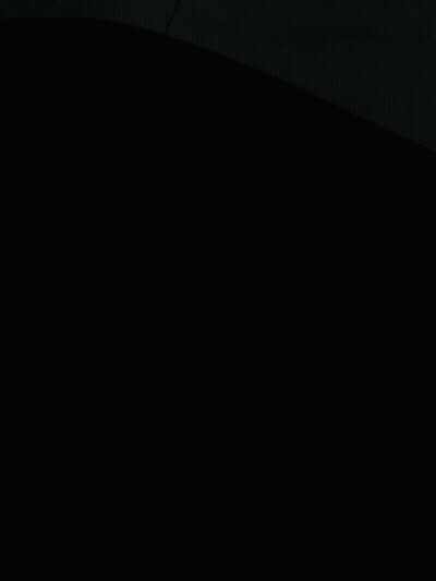 A Bunch Of Blankets Are Stacked On Top Of Each Other On A Bed GIF