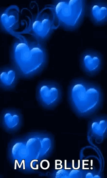A Bunch Of Blue Hearts On A Black Background With The Words `` M Go Blue '' . GIF