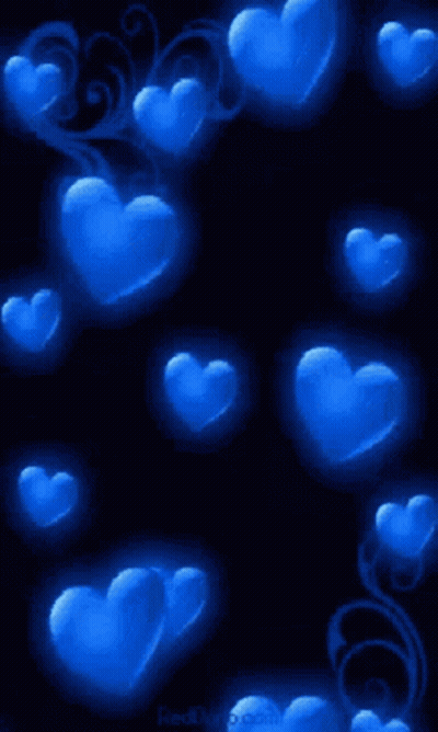 A Bunch Of Blue Hearts On A Dark Background GIF