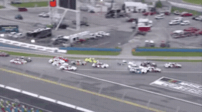 A Bunch Of Cars Are Racing On A Track Sponsored By Busch Coca Cola GIF