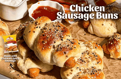 A Bunch Of Chicken Sausage Buns Are On A Table GIF