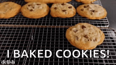A Bunch Of Chocolate Chip Cookies On A Cooling Rack With The Words " I Baked Cookies " GIF
