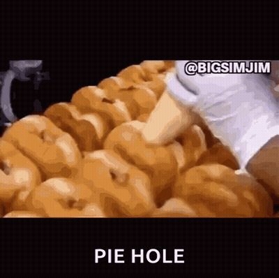 A Bunch Of Donuts Are Sitting On Top Of Each Other With The Words Pie Hole Written In The Corner . GIF