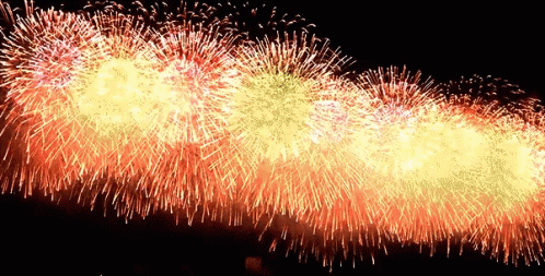 A Bunch Of Fireworks Are Going Off In The Sky GIF