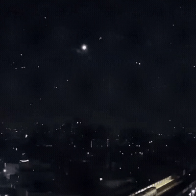 A Bunch Of Fireworks Are Going Off In The Sky GIF