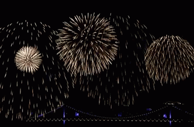 A Bunch Of Fireworks In The Night Sky GIF