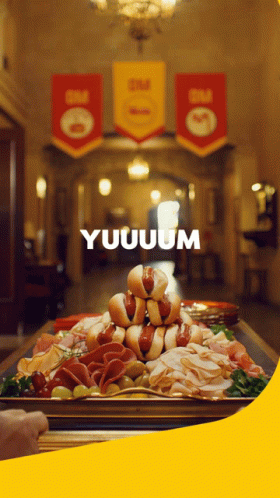 A Bunch Of Food On A Table With The Word Yuuum On The Bottom GIF