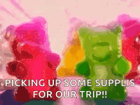 A Bunch Of Gummy Bears Are Sitting Next To Each Other With The Words `` Picking Up Some Supplies For Our Trip ! '' GIF