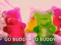 A Bunch Of Gummy Bears Are Standing Next To Each Other With The Words `` Go Buddy ... Go Buddy '' GIF