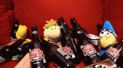 A Bunch Of Ibc Root Beer Bottles On A Couch GIF