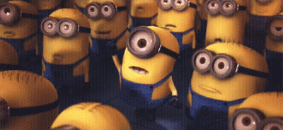 A Bunch Of Minions With Big Eyes Are Standing Next To Each Other . GIF