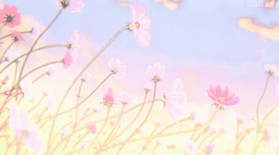 a bunch of pink flowers against a blue sky with nanzs written on the bottom