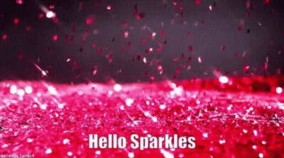 A Bunch Of Pink Glitter Is Falling On A Red Surface . GIF