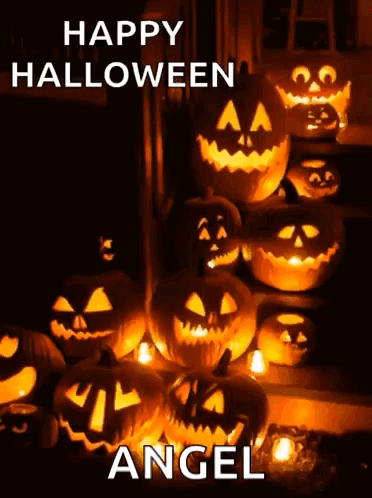 A Bunch Of Pumpkins With Faces Carved Into Them And The Words Happy Halloween Angel Above Them GIF